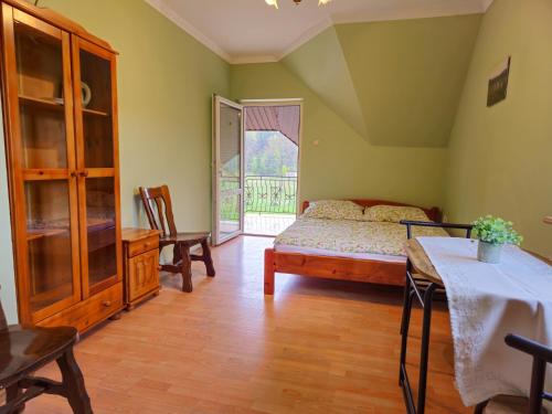 Postel nebo postele na pokoji v ubytování U Gienka Pod Lasem