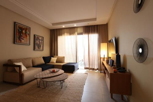a living room with a couch and a table at Immi in Agadir