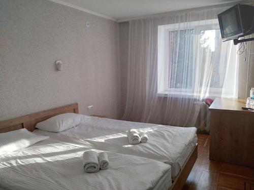 Una cama o camas en una habitación de Hotel Tourist