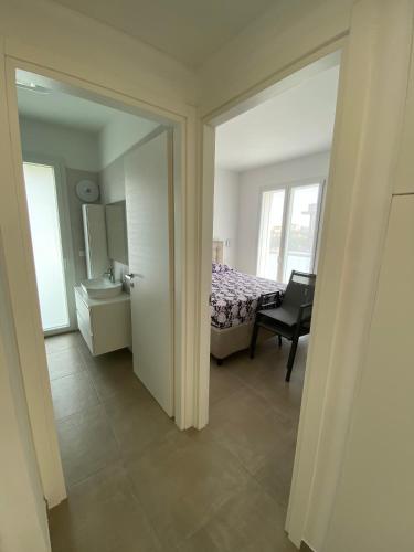 Katil atau katil-katil dalam bilik di New Luxury Apartment with Pool in Borghetto