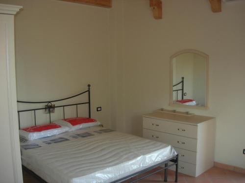 Postel nebo postele na pokoji v ubytování Tenuta Traversa