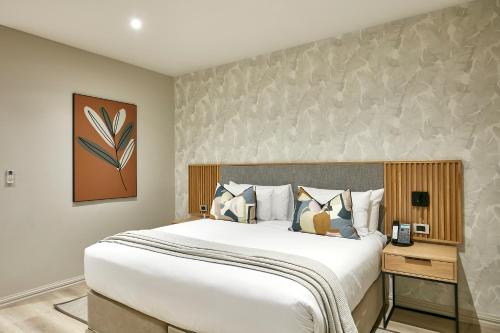 a bedroom with a large bed in a room at Cresta Mahalapye Hotel in Mahalapye