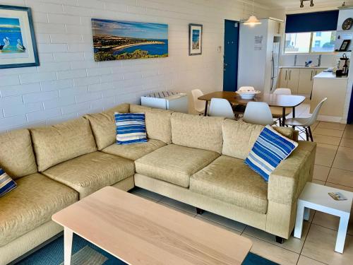 a living room with a couch and a table at 'The Dolphins 7' - 'A View To Remember' in Port Elliot