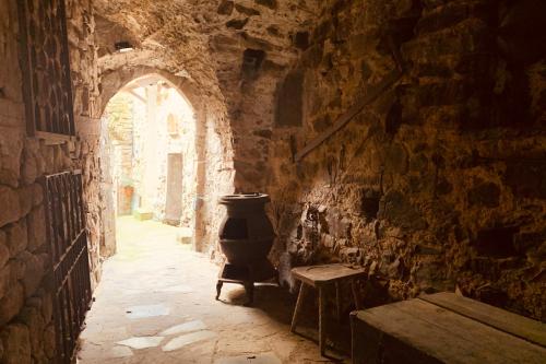a stone hallway with an archway in a building at Mountains' View by Holiday World in Baiardo