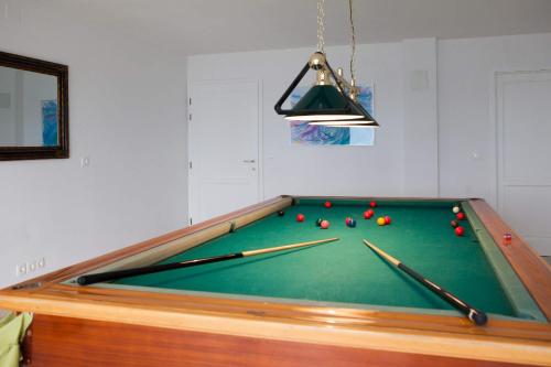a pool table with billiard balls on it at Villa Putto in Vela Luka