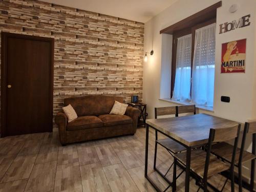 a living room with a couch and a table at La Dimora dei Consoli - Apartment San Peter in Rome