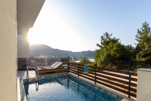 a swimming pool with a view of the mountains at Pearl of Thassos in Skala Potamias