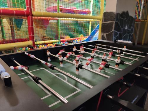 a table with toy robots in a play room at Ostoja Zaskalskie Apartament DIAMENT 100 m2, 56m2 in Jaworki