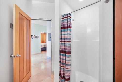 a room with a door and a hallway at Oceanside Escape with 3 Bedrooms Spectacular Ocean View and Pool in Galveston