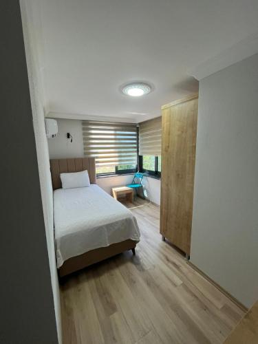 Ένα ή περισσότερα κρεβάτια σε δωμάτιο στο Iotape Hotel Antalya