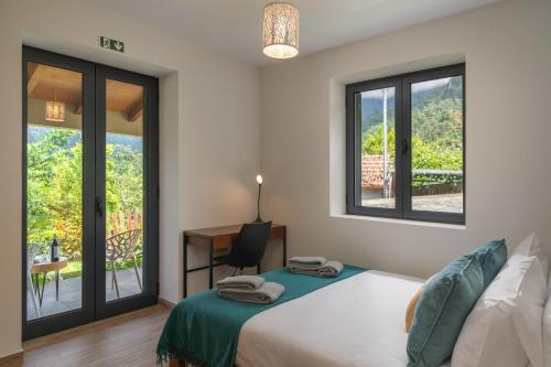 Ένα ή περισσότερα κρεβάτια σε δωμάτιο στο OurMadeira - Casa Hortênsia