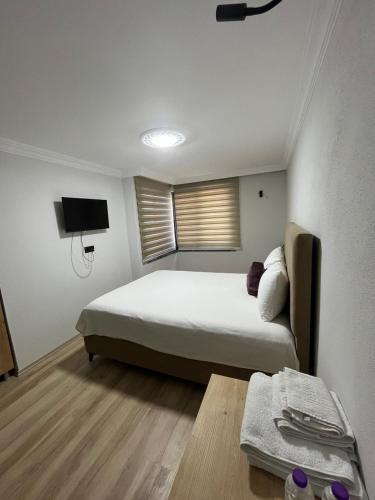 Ένα ή περισσότερα κρεβάτια σε δωμάτιο στο Iotape Hotel Antalya