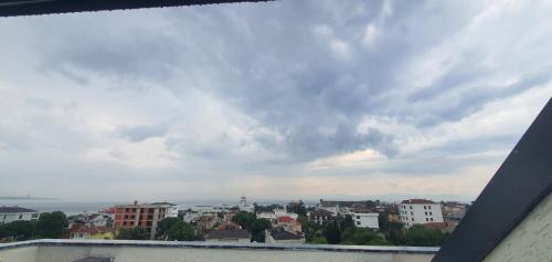 a view of a city under a cloudy sky at Petra Port Hotel in Tuzla
