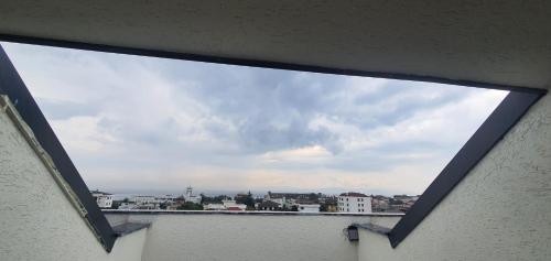 a view of a city from a window at Petra Port Hotel in Tuzla