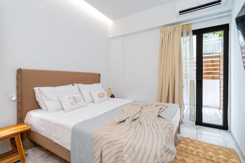 Postel nebo postele na pokoji v ubytování Inia Apartments