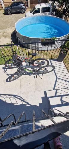 a bike is parked next to a swimming pool at White House Moieciu in Moieciu de Jos
