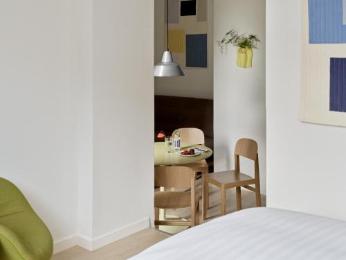 Ένα ή περισσότερα κρεβάτια σε δωμάτιο στο Flora Apartment Hotel