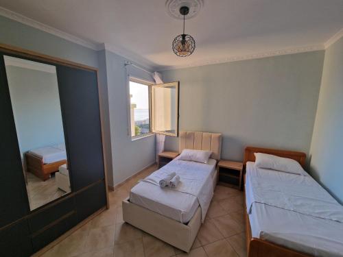Ένα ή περισσότερα κρεβάτια σε δωμάτιο στο Seaview luxury apartment Durres