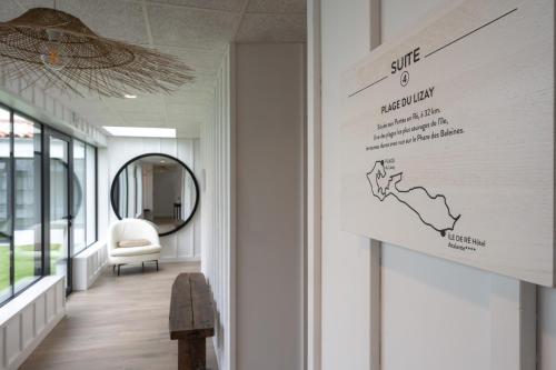 a hallway with a map of australia on a wall at Hôtel Atalante - Relais Thalasso & Spa in Sainte-Marie-de-Ré