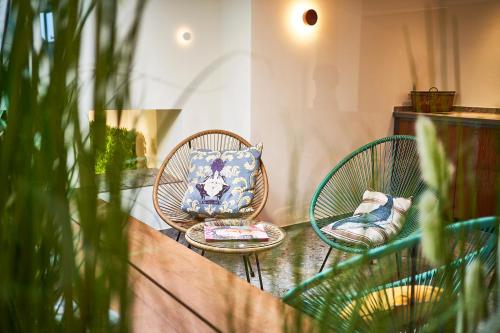 two chairs and a pillow on a table at Hotel City Krone in Friedrichshafen
