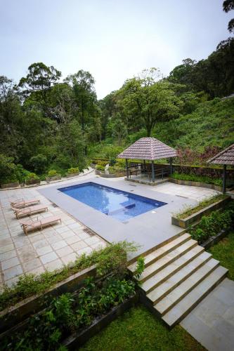 Bazén v ubytování Elixir Woods Luxury Resort And Spa, Munnar nebo v jeho okolí