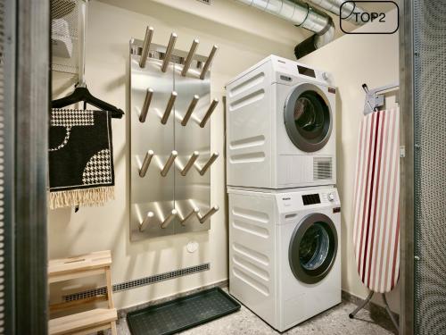 a laundry room with a washer and dryer at Haus am Lift - TOP2 - Summercard included - Ski-in Ski-out - 6P in Zell am See