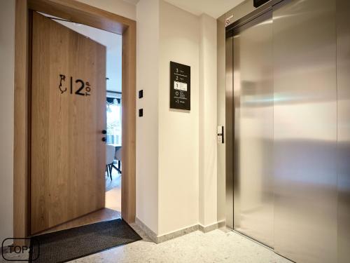 an elevator in a room with a door at Haus am Lift - TOP2 - Summercard included - Ski-in Ski-out - 6P in Zell am See