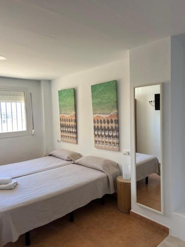 Letto o letti in una camera di Hospedería Almundo by Alexandra Realty