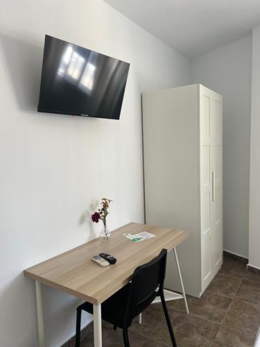 TV o dispositivi per l'intrattenimento presso Hospedería Almundo by Alexandra Realty