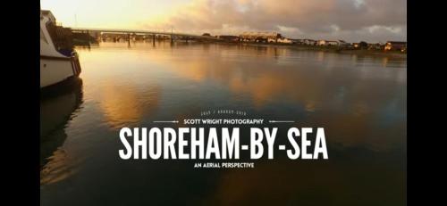 a movie poster of a river with a bridge at Seaview 2 Bedroom House Sleeps 4 - Pets Ok -WiFi in Shoreham-by-Sea