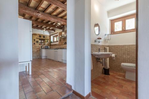 a bathroom with a toilet and a sink at Italian Experience-Casa Bellavista in Ostra