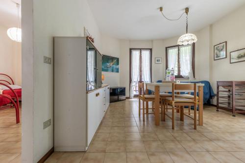 a kitchen and dining room with a table and chairs at Italian Experience-Conero Garden Apartment in Marcelli