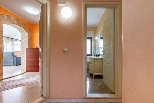 a hallway with an open door to a room with a kitchen at Apartment with Terrace in Aci Catena in Aci Catena