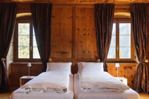 Postel nebo postele na pokoji v ubytování Villa Carisch