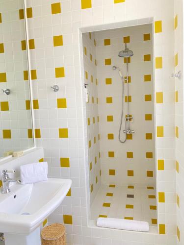 a bathroom with a shower and a sink at LILOU in Hyères