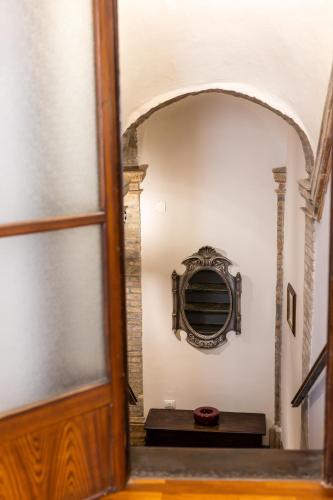 an entrance to a room with a window and a staircase at Palazzo Crescimbeni in Bevagna