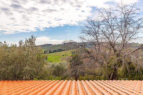 an orange tile roof with a view of a field at Italian Experience- Villa La Pagliarina in Cartoceto