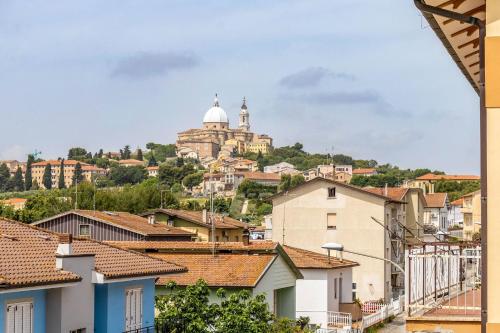 a cityscape of a town with a church on a hill at Italian Experience- Maison Loreto in Loreto