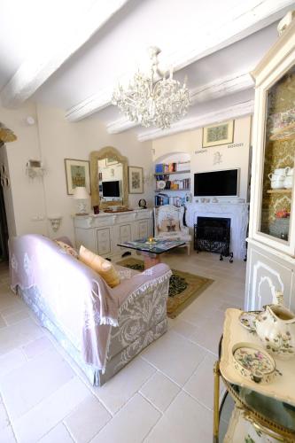 a living room with a couch and a fireplace at La casa di sotto by PortofinoVacanze in Camogli