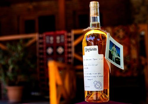 a bottle of whisky sitting on top of a table at Brothers khutsishvili wine cellar in Kisiskhevi