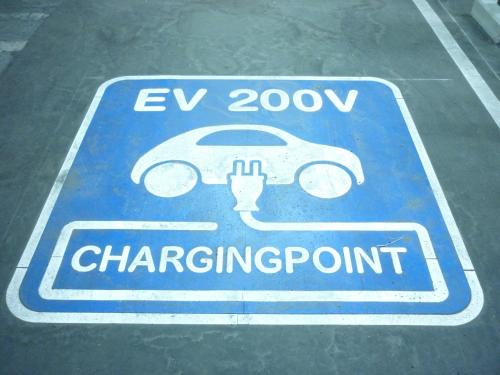 a sign for a car charging point on a parking lot at APA Hotel Honhachinohe in Hachinohe