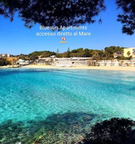 an image of a beach with the words bicheno apartments accesso ghetto all at BlueSun Apartments in Leporano Marina