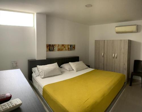 Postel nebo postele na pokoji v ubytování Hotel Onix T