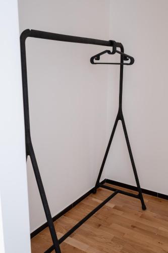 a black metal stand with a white wall at FP Apartments Pizzo in Pizzo