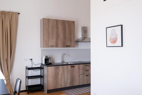 a kitchen with a sink and a counter top at FP Apartments Pizzo in Pizzo