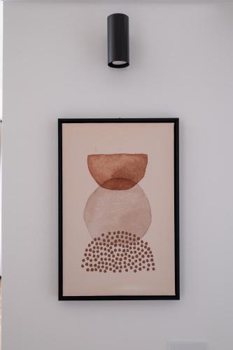 a picture of a painting on a wall at FP Apartments Pizzo in Pizzo