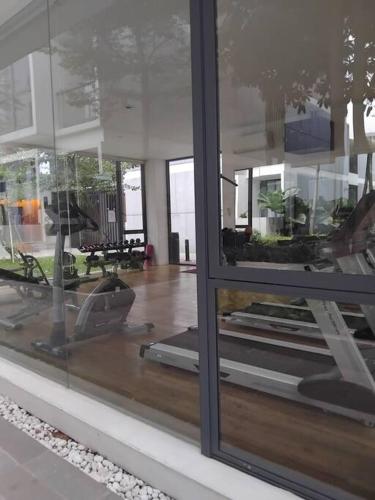 a window of a building with a view of a room at Chic n Spacey 3BR apartment at the Rosebay in Surabaya
