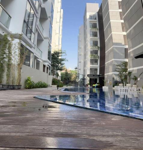 a swimming pool in the middle of a building at Chic n Spacey 3BR apartment at the Rosebay in Surabaya