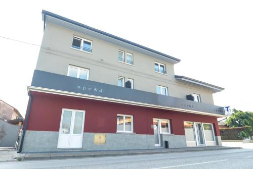 a building on the side of a street at Spe&d in Rivis