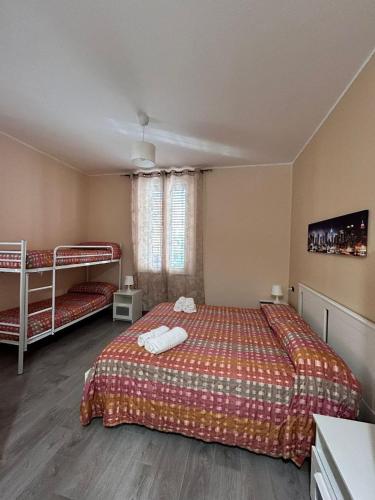 a bedroom with a bed and bunk beds in it at B&B Metropolitan RC in Reggio Calabria